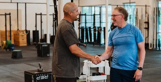 Member with a coach on a training at The Tribe