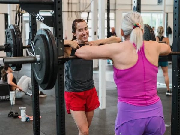 Women smiling after a training at the Tribe