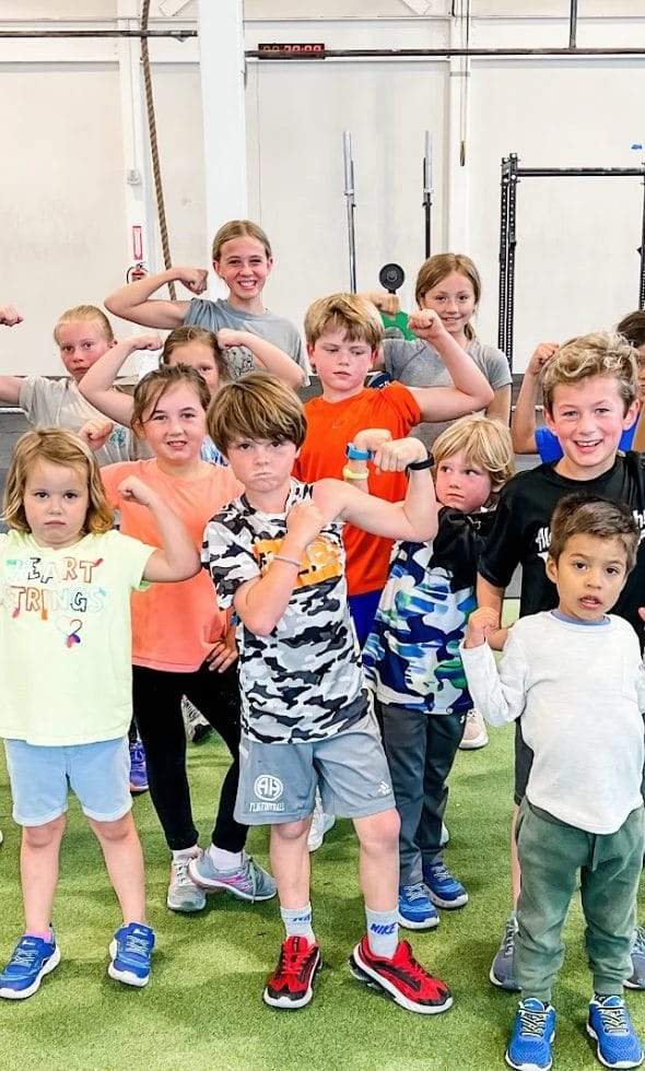 kids showing his muscles at The Tribe