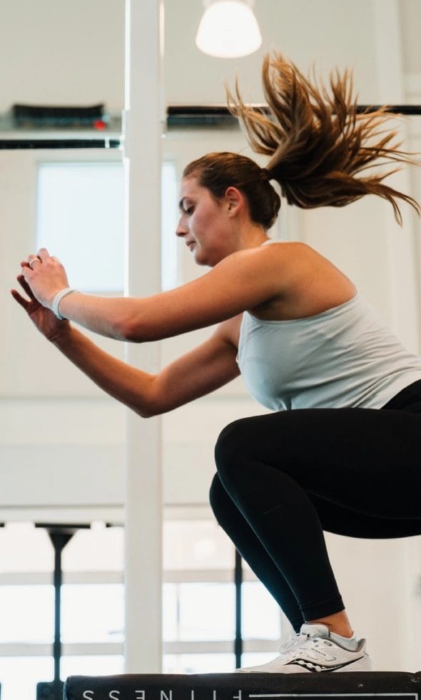 Woman jumping at The Tribe